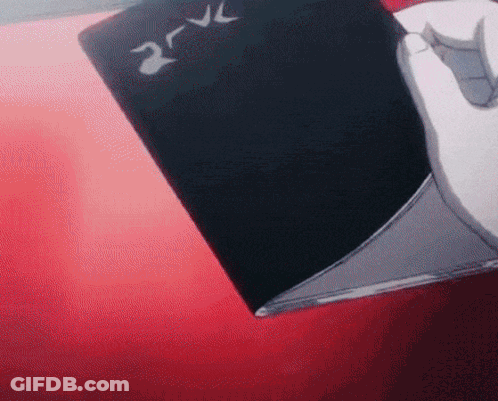 Person Holding Black Devil Book GIF