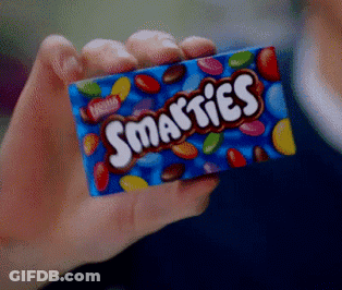 Person Holding Blue Box Of Smarties GIF