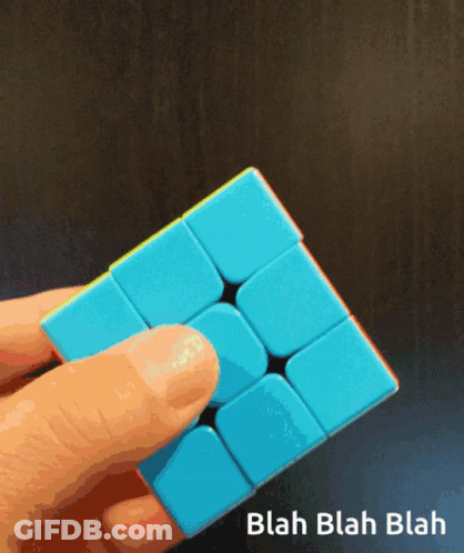 Person Holding Blue Cube Saying Blah Blah Blah GIF