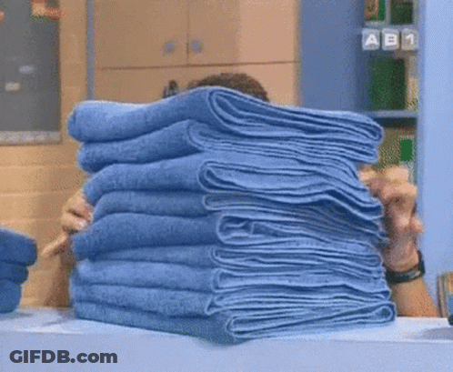 Person Holding Blue Towels GIF