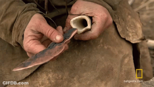Person Holding Bone And Knife GIF