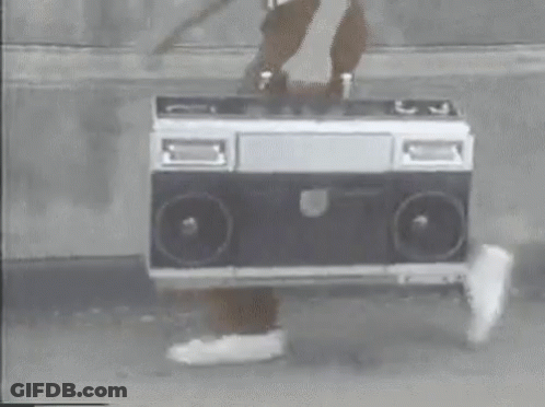 Person Holding Boombox On Sidewalk GIF