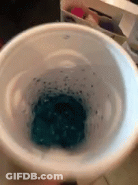 Person Holding Bowl Of Blue Liquid GIF