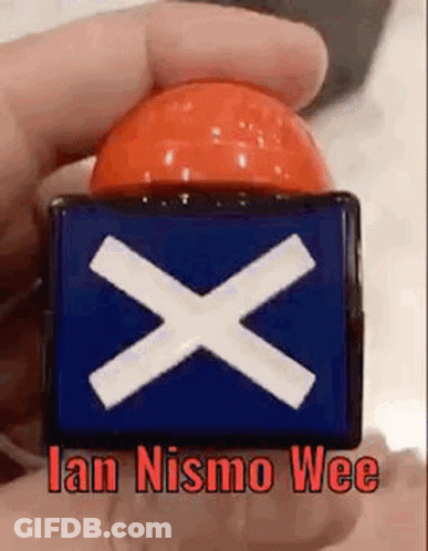 Person Holding Button With Cross And Ian Nismo Wee GIF