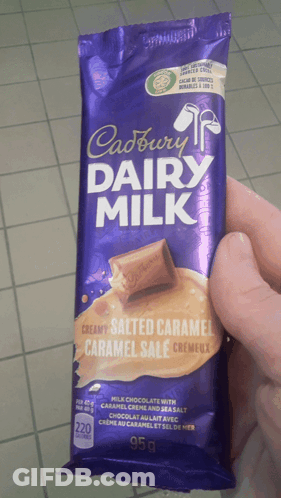 Person Holding Cadbury Dairy Milk Bar GIF
