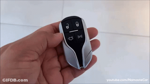 Person Holding Car Key Fob Youtube.com/namastecar GIF