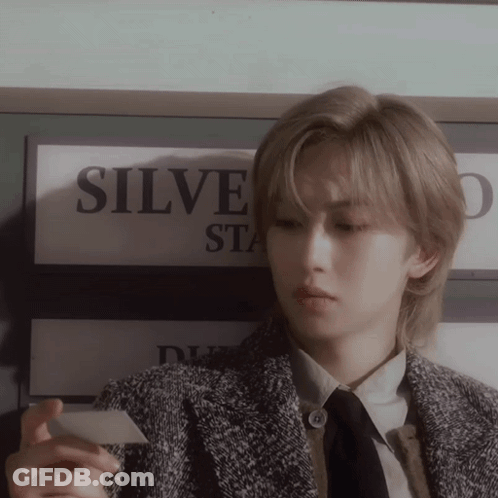 Person Holding Card Near Sign Saying Silve GIF