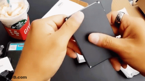 Person Holding Card Saying Give GIF