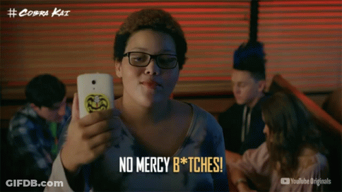 Person Holding Cell Phone Saying No Mercy B*tches GIF