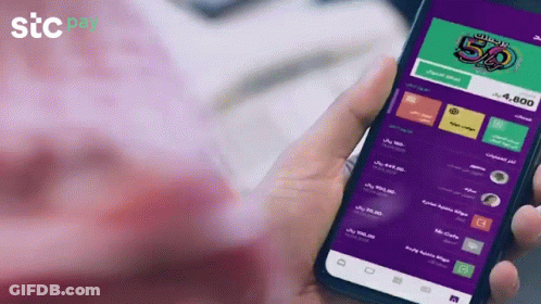 Person Holding Cell Phone Saying STC Pay GIF