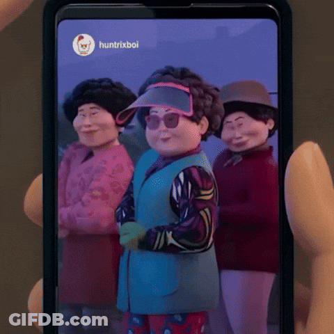 Person Holding Cell Phone With Cartoon Characters GIF