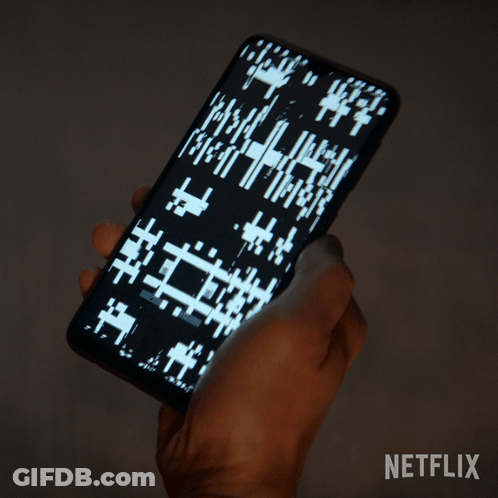 Person Holding Cell Phone With Netflix Logo GIF