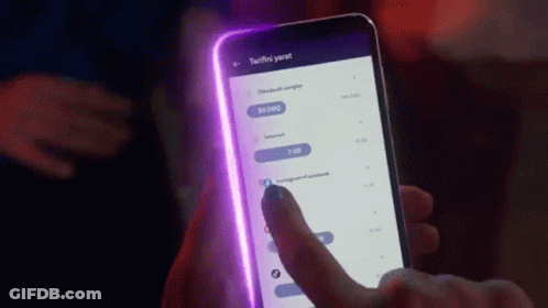 Person Holding Cellphone With Purple Light GIF