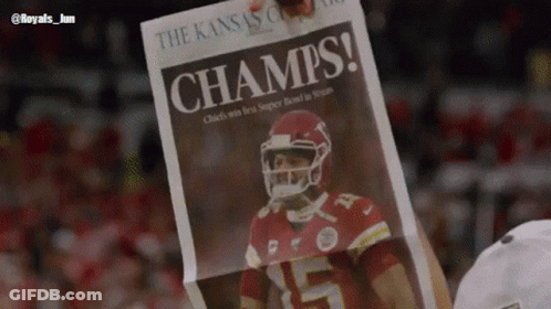 Person Holding Champs Newspaper GIF