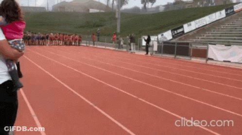 Person Holding Child On Track Clideo.com GIF