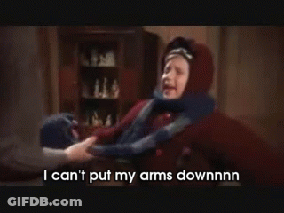 Person Holding Child's Arm Saying I Can't Put My Arms Downnnn GIF