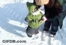 Person Holding Child Walking In Snow GIF