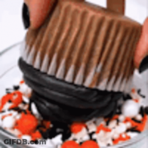 Person Holding Chocolate Peanut Butter Cup GIF