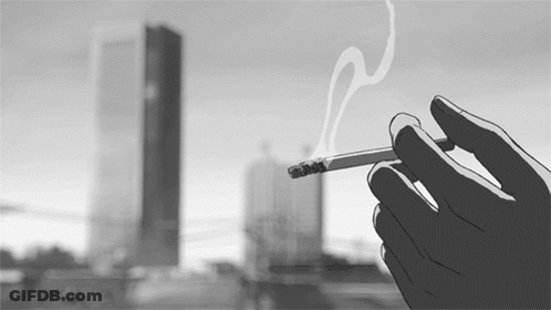 Person Holding Cigarette In City GIF