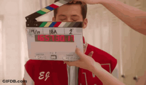 Person Holding Clapper Board 18A 2 GIF