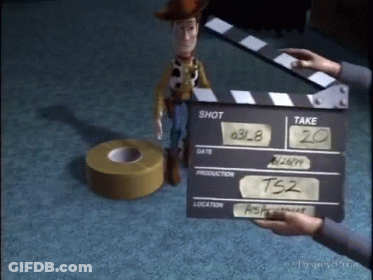 Person Holding Clapper Board Saying Shot And Take GIF