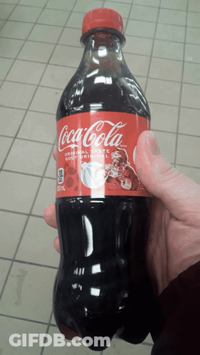 Person Holding Coca-Cola Bottle GIF