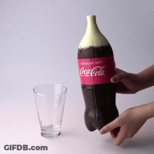 Person Holding Coca Cola Bottle With Chocolate Top GIF