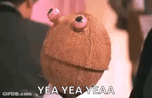 Person Holding Coconut With Eyes GIF