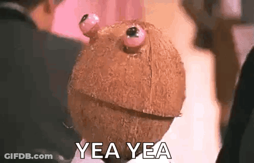 Person Holding Coconut With Eyes GIF