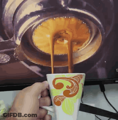 Person Holding Coffee In Front Of Samsung Screen GIF