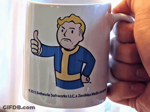 Person Holding Coffee Mug Saying 2015 Bethesda Softworks LLC GIF