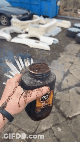 Person Holding Coke D'Ice Bottle GIF