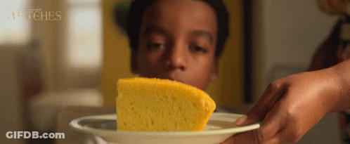 Person Holding Cornbread Saying Witches GIF