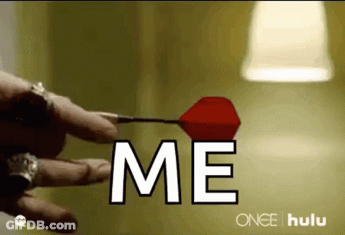 Person Holding Dart Saying Me GIF