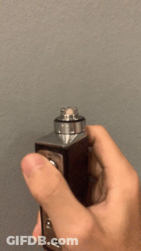 Person Holding Device With Smoke GIF
