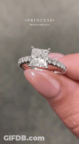 Person Holding Diamond Ring GIF