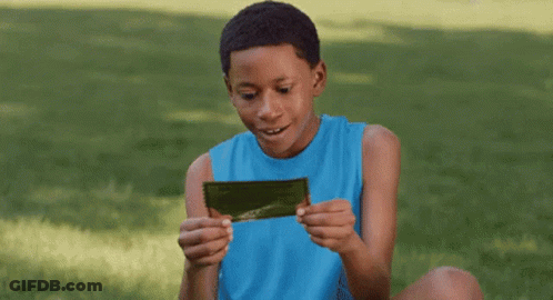 Person Holding Exclusive Free Edu Sign GIF
