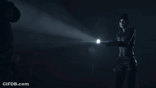 Person Holding Flashlight In Dark GIF