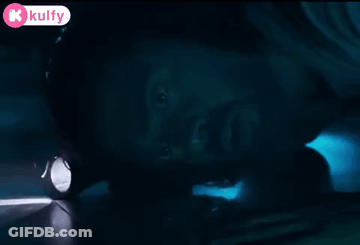 Person Holding Flashlight In Dark Room GIF