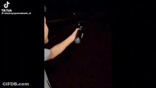 Person Holding Flashlight Walking GIF