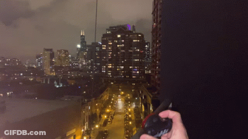 Person Holding Flashlight With Chicago Lanyard GIF