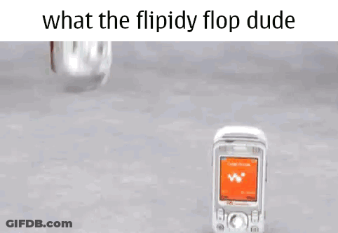 Person Holding Flip Phone Looking At It GIF