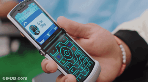 Person Holding Flip Phone With Skype Chat Calling GIF