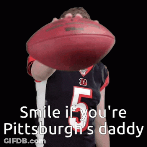 Person Holding Football Saying Smile If You're Pittsburgh's Daddy GIF