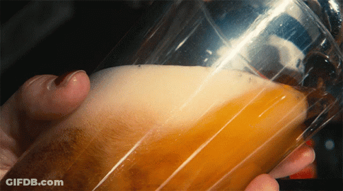 Person Holding Glass Of Beer With Foam GIF