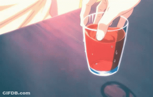Person Holding Glass Of Red Liquid GIF