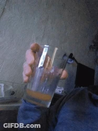 Person Holding Glass Sticker Saying I'm GIF