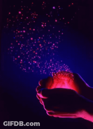 Person Holding Glowing Object In Dark GIF