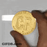 Person Holding Gold Coin With CP GIF