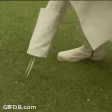 Person Holding Golf Club On Tee GIF
